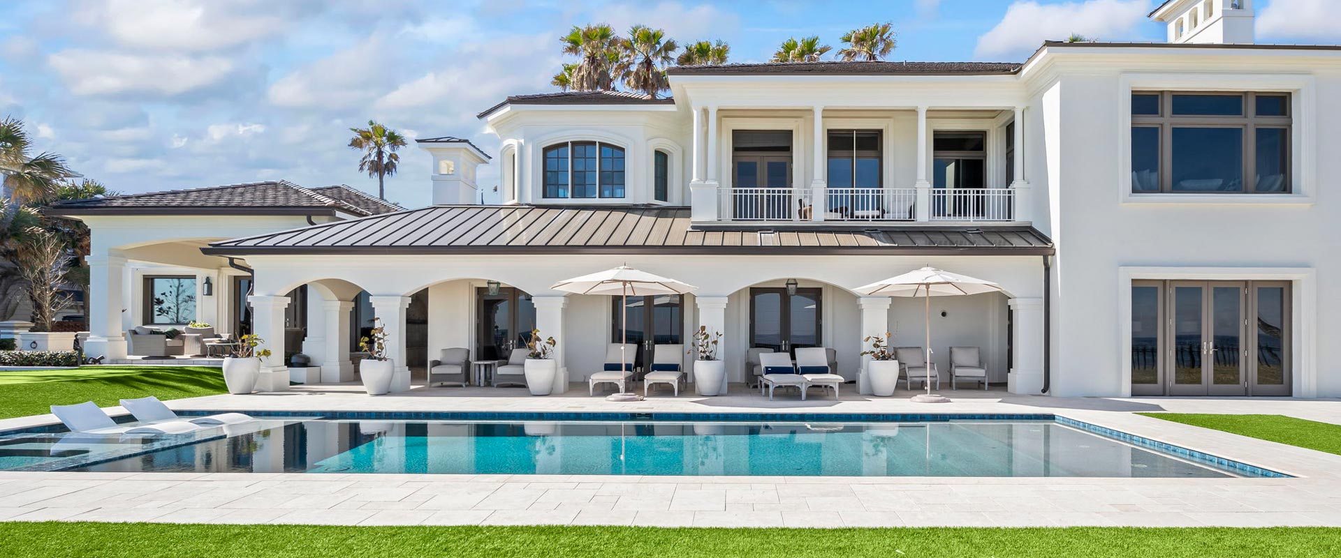 pool outside large house