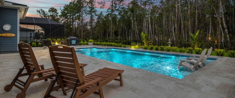 Pool design by Coastal Luxury Outdoors in Jacksonville, FL, showcasing elegant landscaping