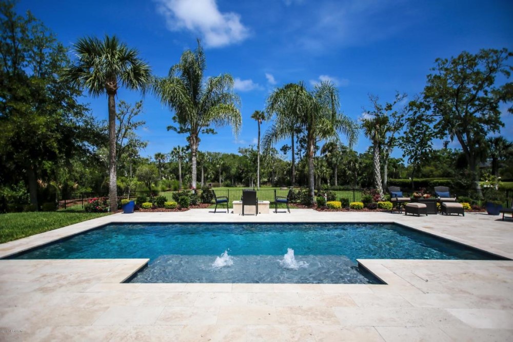 Blue Pearl pool design by Coastal Luxury Outdoors in Jacksonville, FL, with stunning finishes