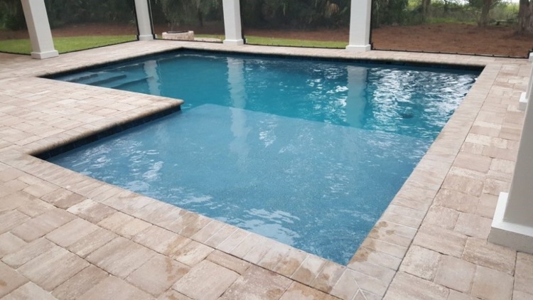 Pool property with palm trees and a large pool on the island of Majestic Isle in Jacksonville, FL.