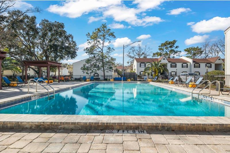 Park pool in Jacksonville and St. Augustine with clear water, shade trees, and relaxing vibes.