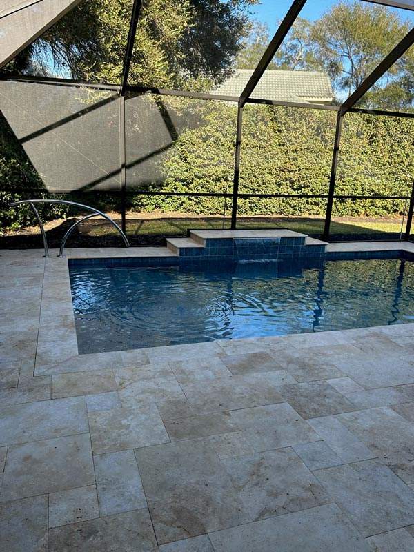 Elegant backyard pool design with tropical landscaping in Jacksonville, FL