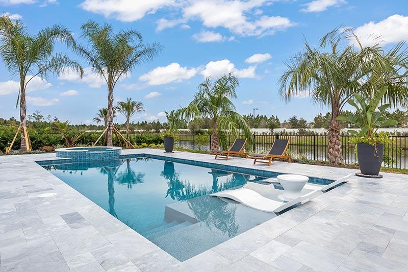 A residence featuring a modern pool and patio in Jacksonville, FL
