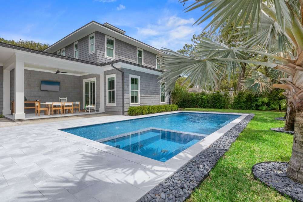 Modern grey‑toned residential swimming pool in Harbor Winds, FL