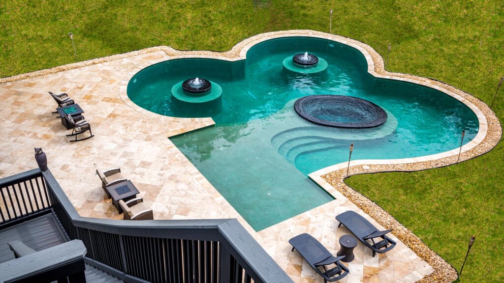 view of unique pool with fountains