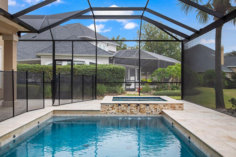 pool and spa with water feature