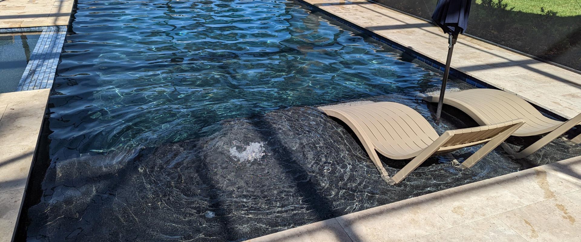 lounge chairs in pool