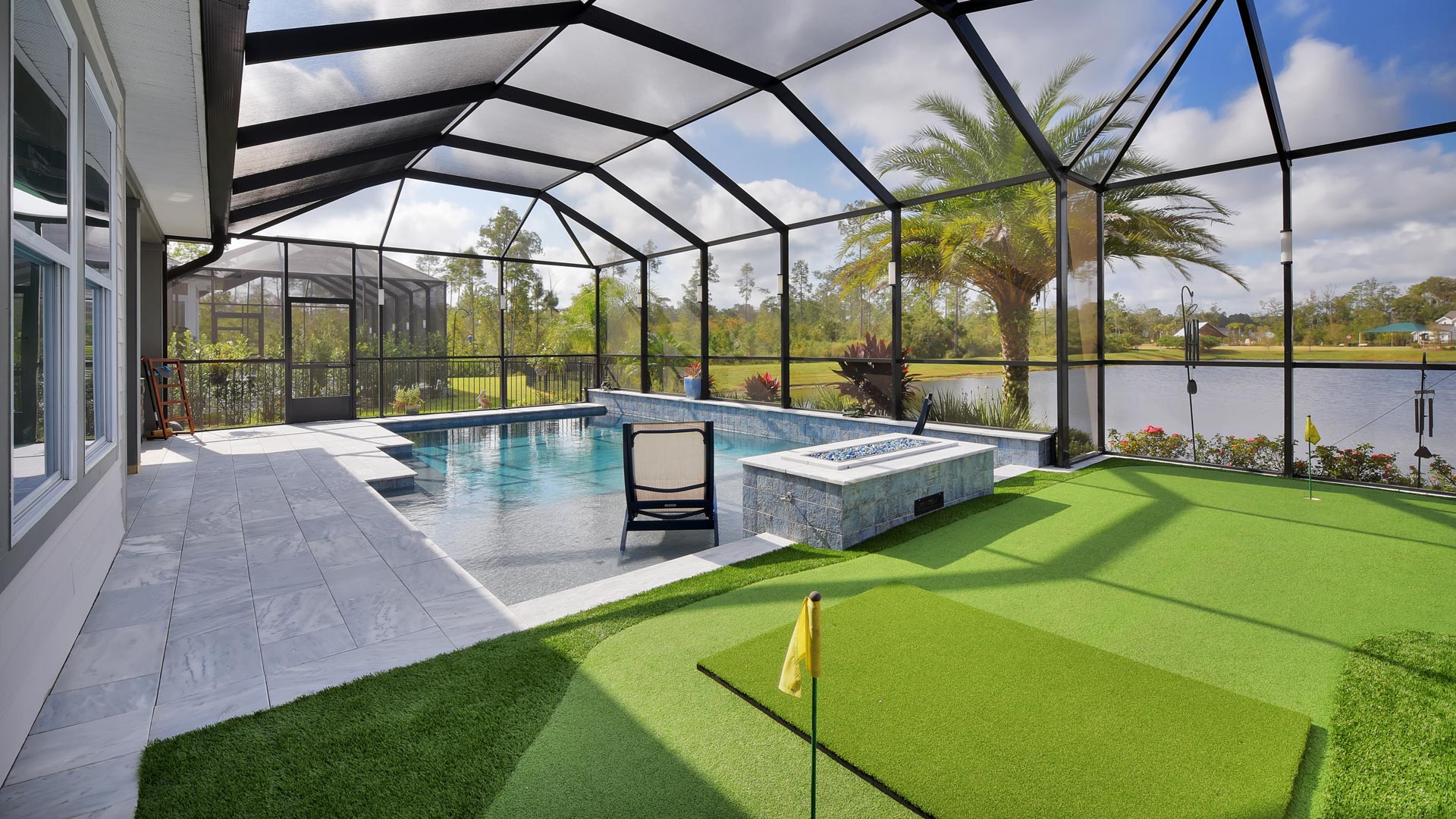 pool and putting green in backyard
