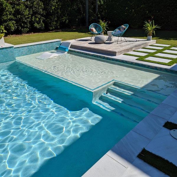 Newly remodeled residential pool with fresh tiling and replastering