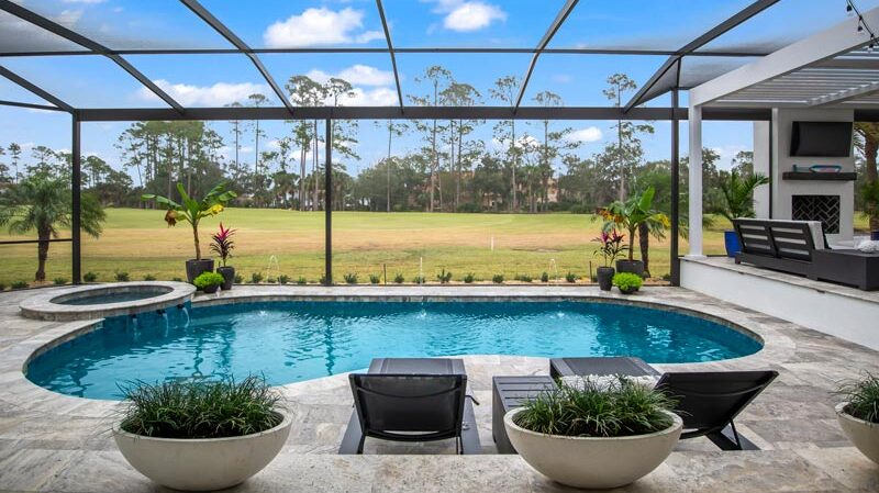 Deck outdoor pool by Coastal Luxury Outdoors in Jacksonville, FL.